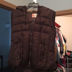 Fur hooded brown vest.